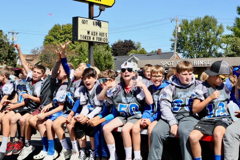 Fifth grade football players ride a float during the Homestead Festival Parade on Saturday, Sept 7, 2024 in Princeton.