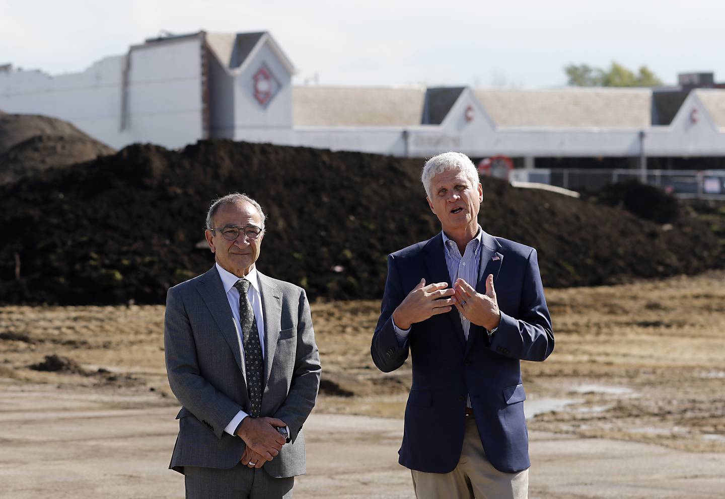 Tim Grogan of Heartland Real Estate Partners, right, and Crystal Lake Mayor Haig Haleblian talk during a groundbreaking event for the Water’s Edge development on Wednesday, Oct. 18, 2023. The development will include new commercial buildings, townhomes and apartments.