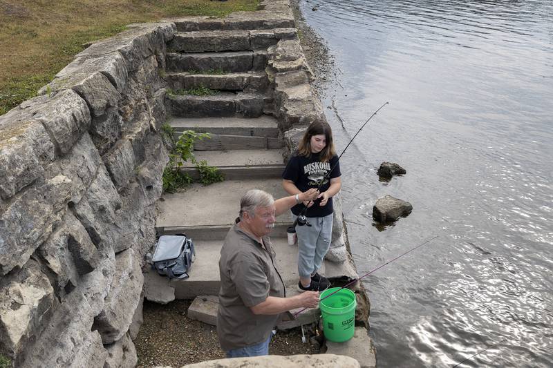 Tom Buskohl and granddaughter Cora of Polo try their luck at the Elk’s Club Fishing Derby Saturday, July 1, 2023 at Petunia Fest.