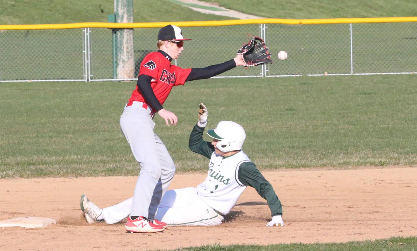 St. Bede's Aiden Mullane slides safely into second as Indian Creek's Tyler Bogle misses the throw on Thursday, March 28, 2024 at St. Bede Academy.