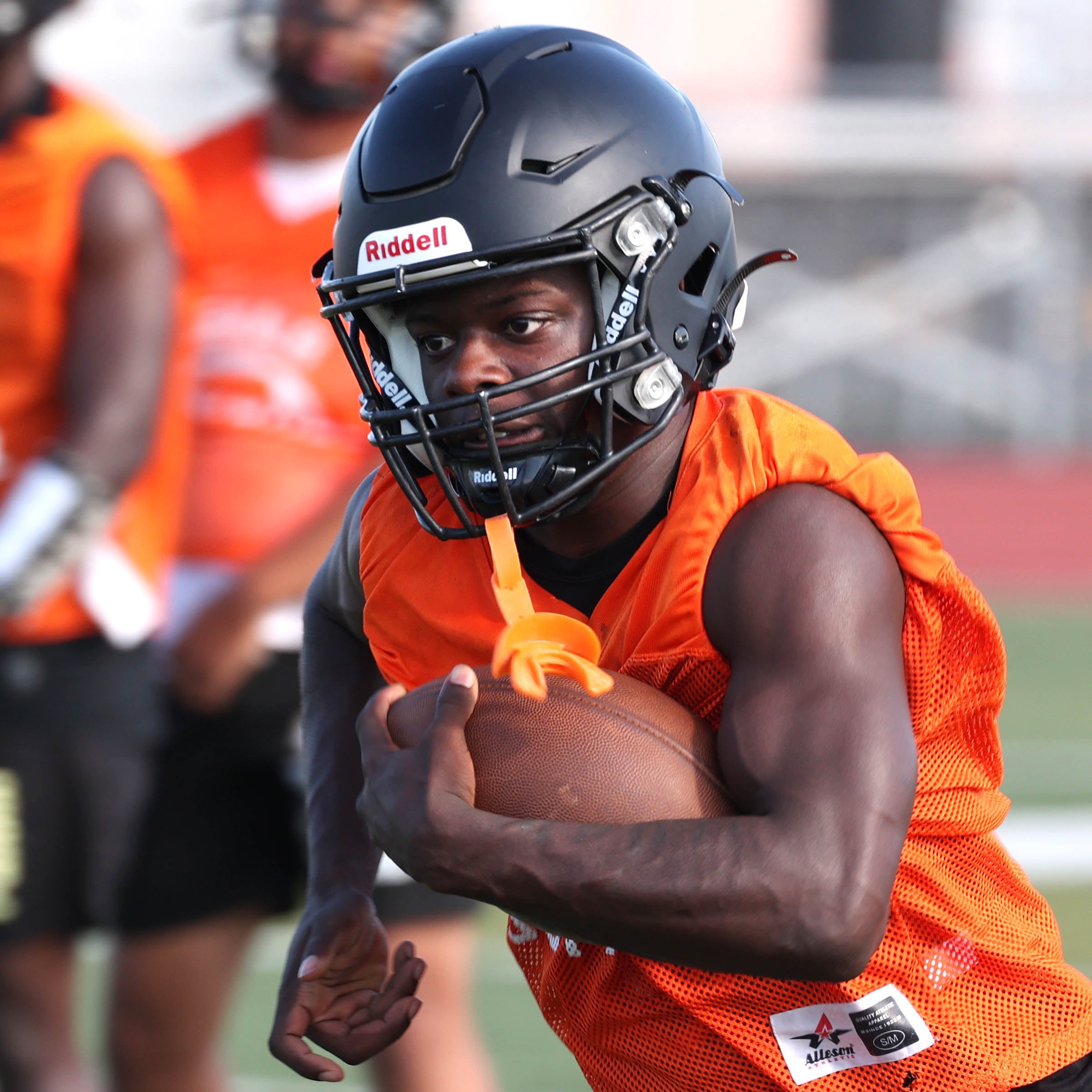 Dekalb’s Mariyan Dudley carries the ball Monday, Aug. 12, 2024, at the school during the first practice of the regular season.