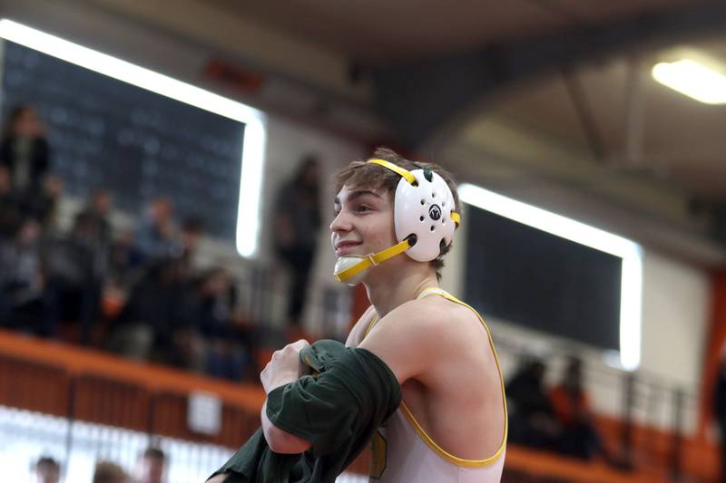 Crystal Lake South’s Josh Glover prepares to enter the ring for the title bout at 113 pounds during IHSA Class 2A regional wrestling at Crystal Lake Central Saturday. Glover won the title over Wauconda’s Gavin Rockey.