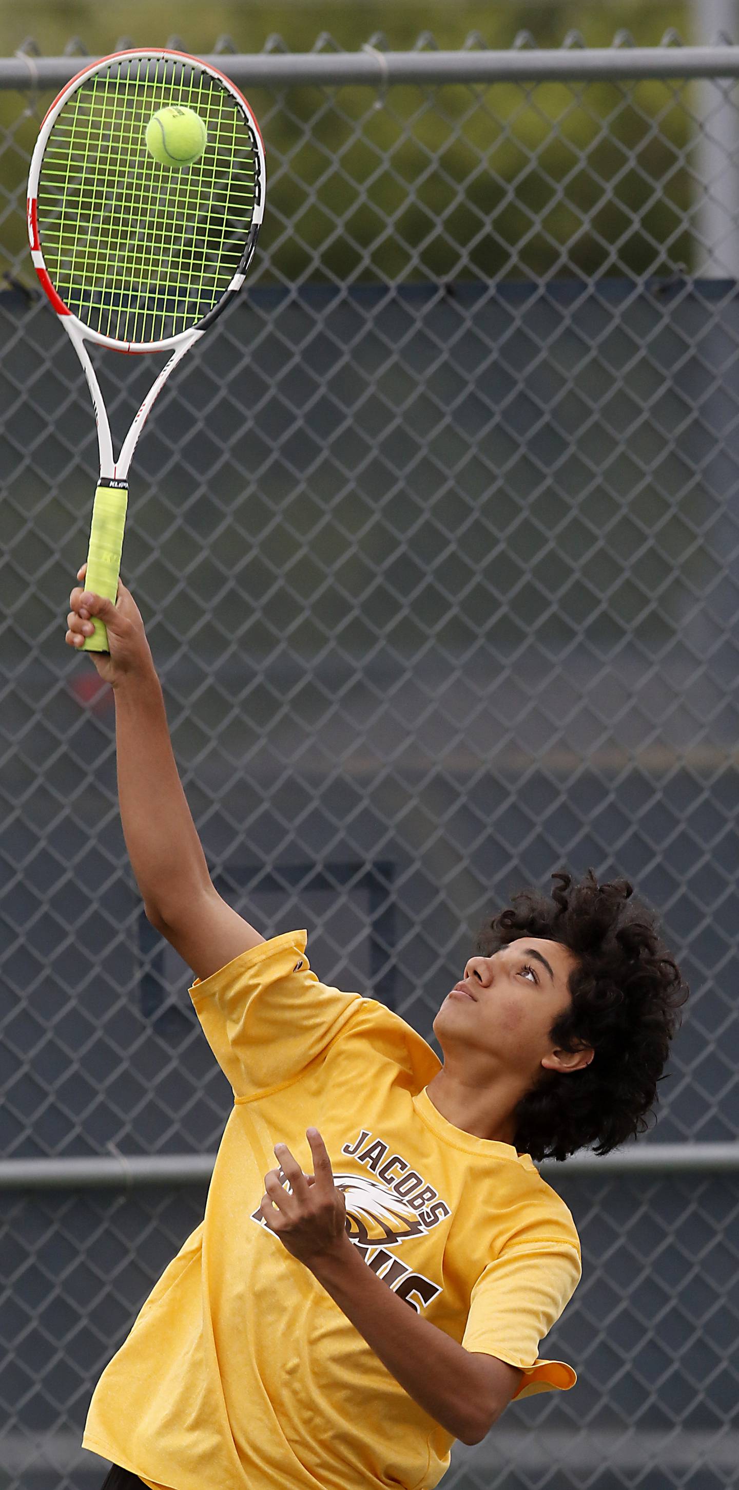Jacobsâ€™ Soham Kalra serves the ball during a IHSA 2A boys doubles tennis match Thursday, May 25, 2023, at Buffalo Grove High School.