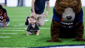 Baby crawls to victory at EGO Outdoor Power Equipment Chicago Bears training camp