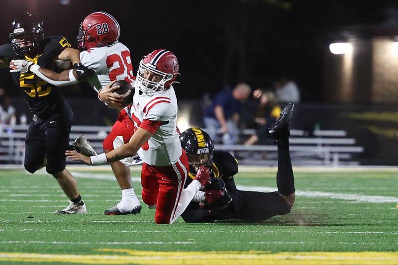 Joliet West’s Sedrick Love sacks Yorkville’s Jack Beethamon Friday, Sept. 13, 2024 in Joliet.