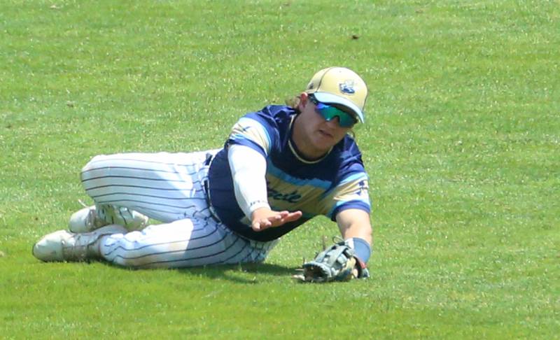 Marquette center fielder Grand Dose makes a diving catch against Routt during the Class 1A semifinal game on Friday, May 31, 2024 at Dozer Park in Peoria.