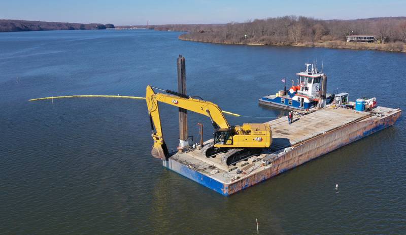 An escavator dredges near Delbridge Island about a mile east of the Starved Rock Lock and Dam on Tuesday, Feb. 13, 2024 near Starved Rock State Park. The Starved Rock Breakwater project is a habitat restoration effort designed to restore submerged aquatic vegetation in the Illinois River, Starved Rock Pool. It will increase the amount and quality of resting and feeding habitat for migratory waterfowl and improve spawning and nursery habitat for native fish.
Construction of the breakwater will involve placement of riprap along northern edge of the former Delbridge Island, adjacent to the navigation channel between River Mile 233 and 234. The breakwater structure will be approximately 6,100 feet long and constructed to a design elevation 461.85 feet, providing adequate protection to allow for submerged aquatic vegetation growth.
The estimated total cost of this project is between $5 and $10 million.