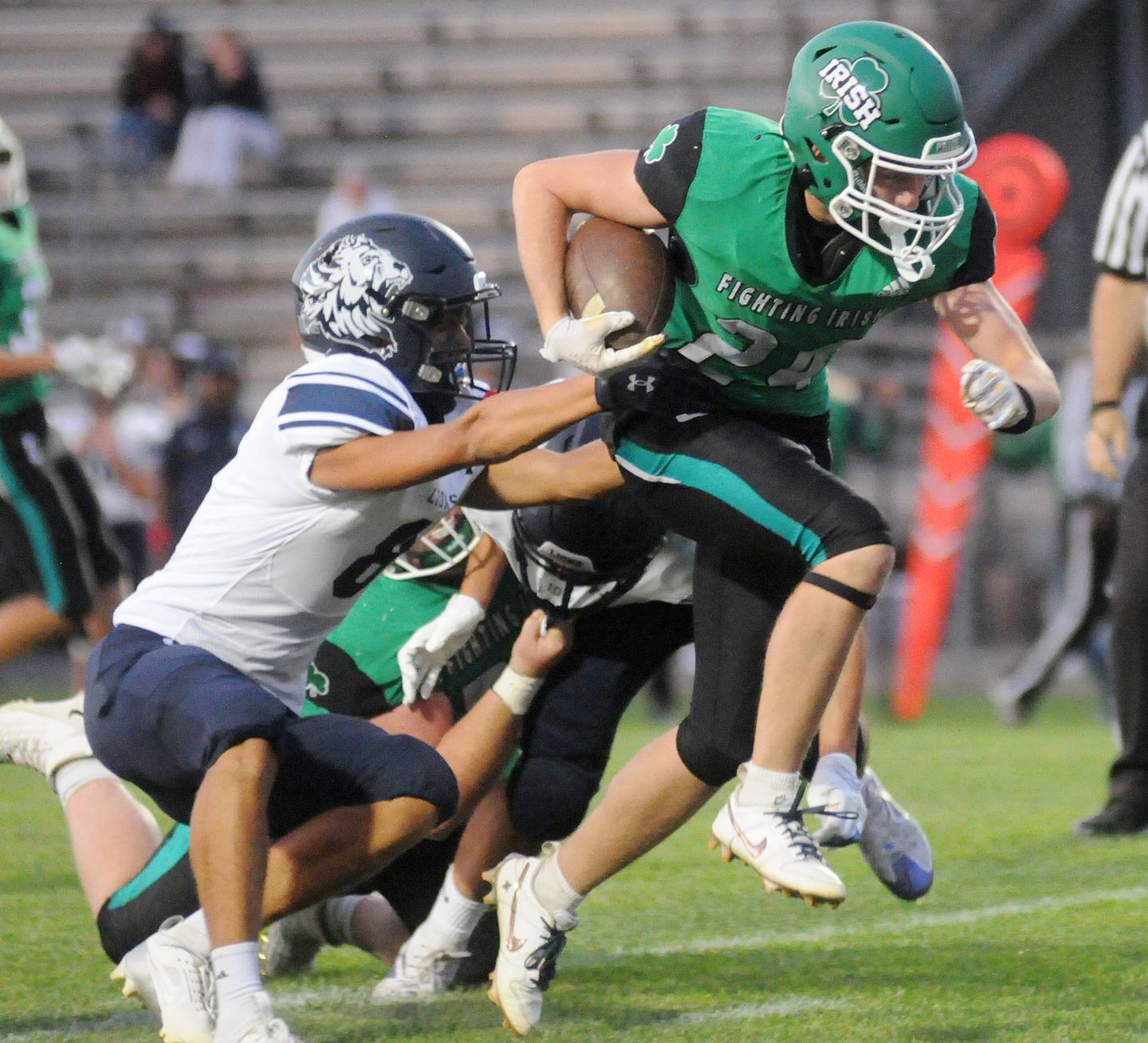 Lisle's Justin Dobilas pulls down Seneca's Brody Rademacher at Seneca on Friday, Sept. 6, 2024.