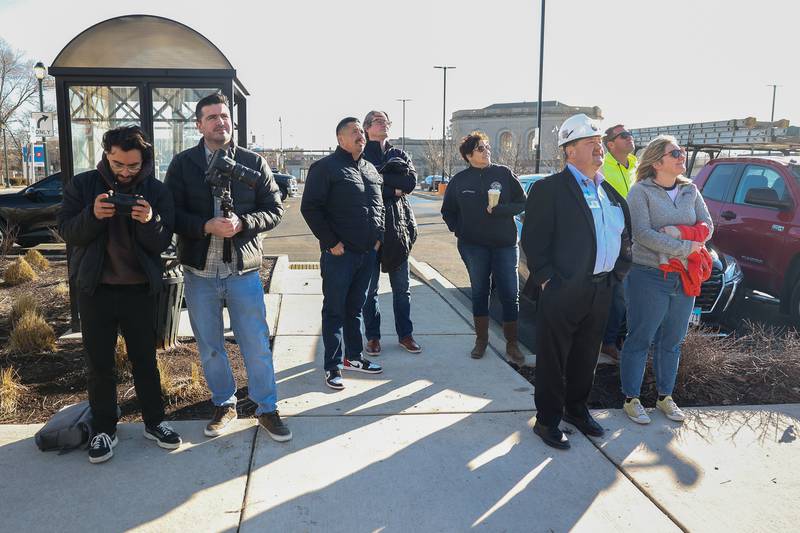 Members of Will County and Joliet City Council watch the beginning of the external demolition of the old Will County Courthouse on Friday, Feb. 9th 2024 in Joliet.