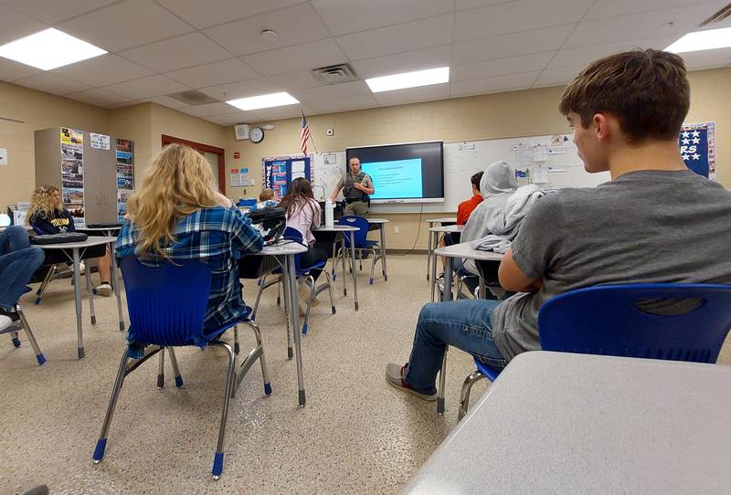 Illinois Department of Natural Resources Officer Kyle Behrens speaks to Annika Cadegiani's class about his career Friday, May 3, 2024, at Grand Ridge Grade School.