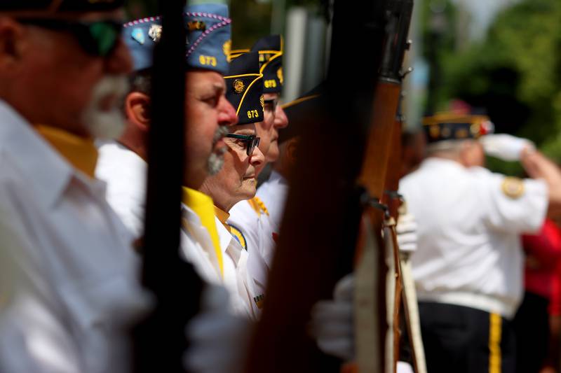 Members of Huntley American Legion Post 673 salute as part of the Huntley Memorial Day parade and observance Monday.