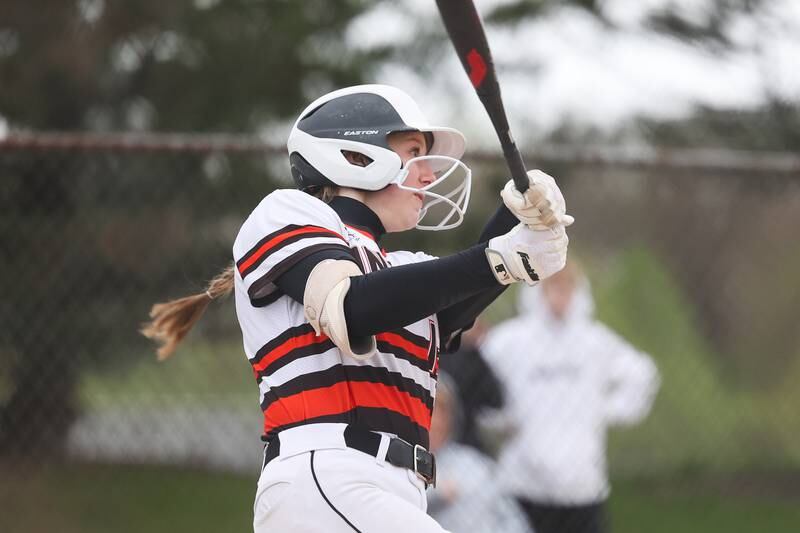 Minooka’s Gracie Anderson connects for a solo home run against Oswego on Wednesday, April 17, 2024 in Minooka.