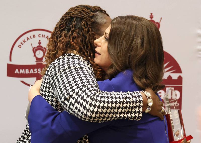 Cortney Strohacker (right) hugs Lucretia Konan after being inducted into the Hall of Fame Thursday, Feb. 8, 2024, during the DeKalb Chamber of Commerce’s Annual Celebration Dinner in the Barsema Alumni and Visitors Center at Northern Illinois University.