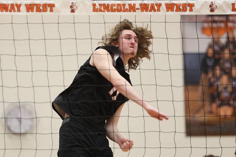 Lincoln-Way West’s Connor Jaral follows through on a kill against Providence in April 2024 in New Lenox.