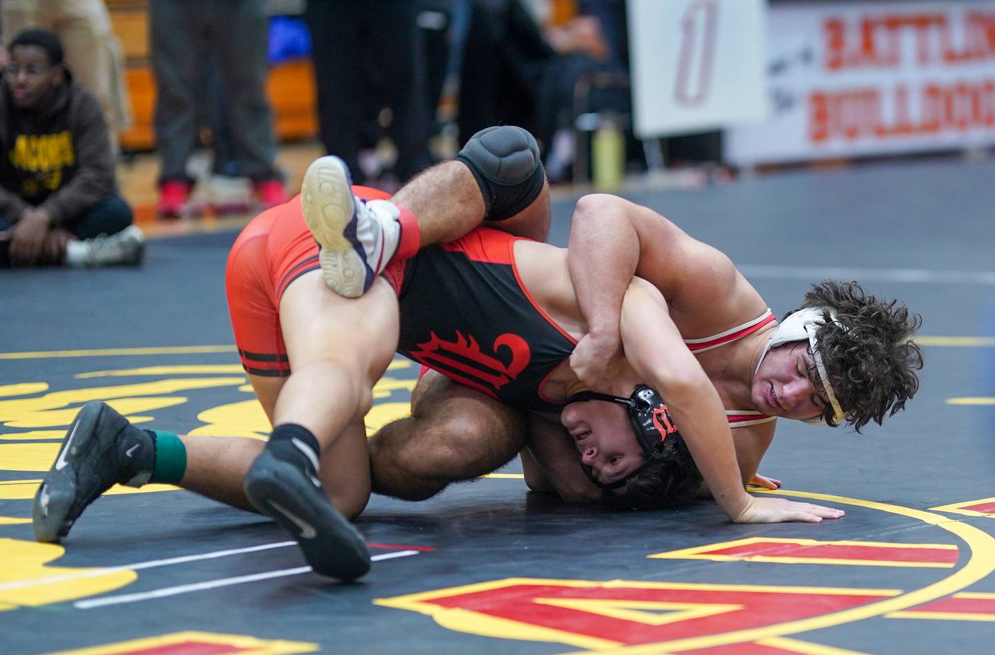 Marmion’s Joseph Favia fights for position over Washington’s Josh Hoffer In a 215-pound championship match during The Clint Arlis Invitational Wrestling meet at Batavia High School in Batavia on Saturday, Jan 13, 2024.