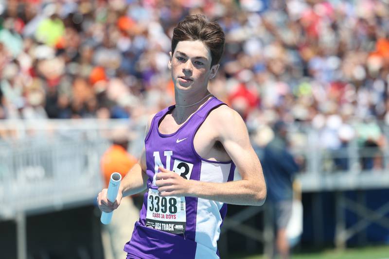 Downers Grove North’s Ryan Eddington rounds a turn in the Class 3A 4x800 Meter Relay State Championship on Saturday, May 25, 2024 in Charleston.