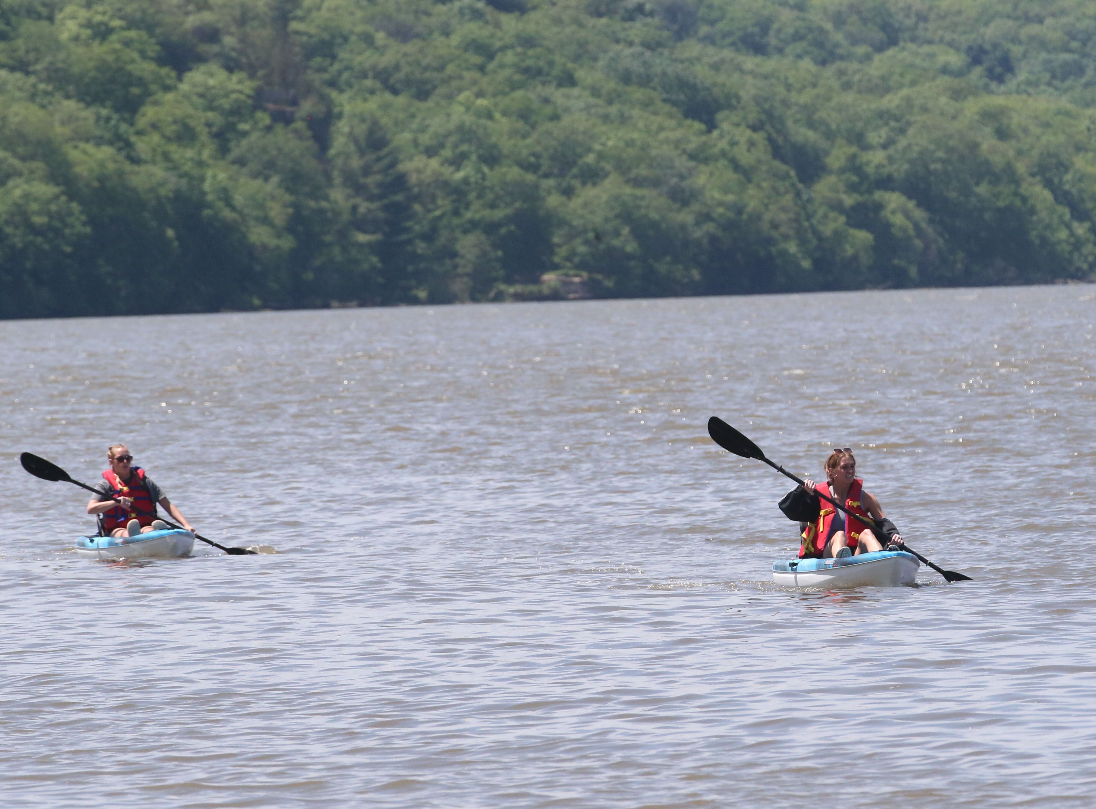 Emma and Abby Happ, both of Peru, kayak along the Illinois River near Lone Point Shelter on Tuesday, May 16, 2023, at Starved Rock State Park. When Louis Jolliet and Father Jacques Marquette explored the Illinois River in 1673 it was much shallower in this area at the time.