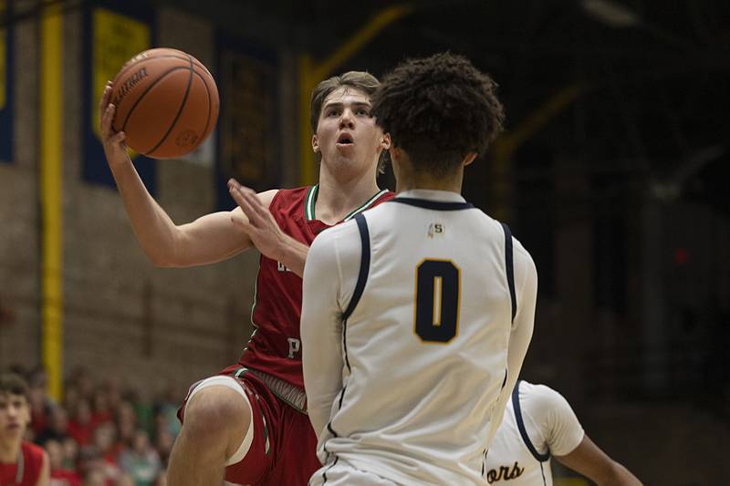 LaSalle-Peru’s Seth Adams fouls Sterling’s Andre Klaver Friday, Feb. 23, 2024 during a class 3A regional final at Sterling High School.