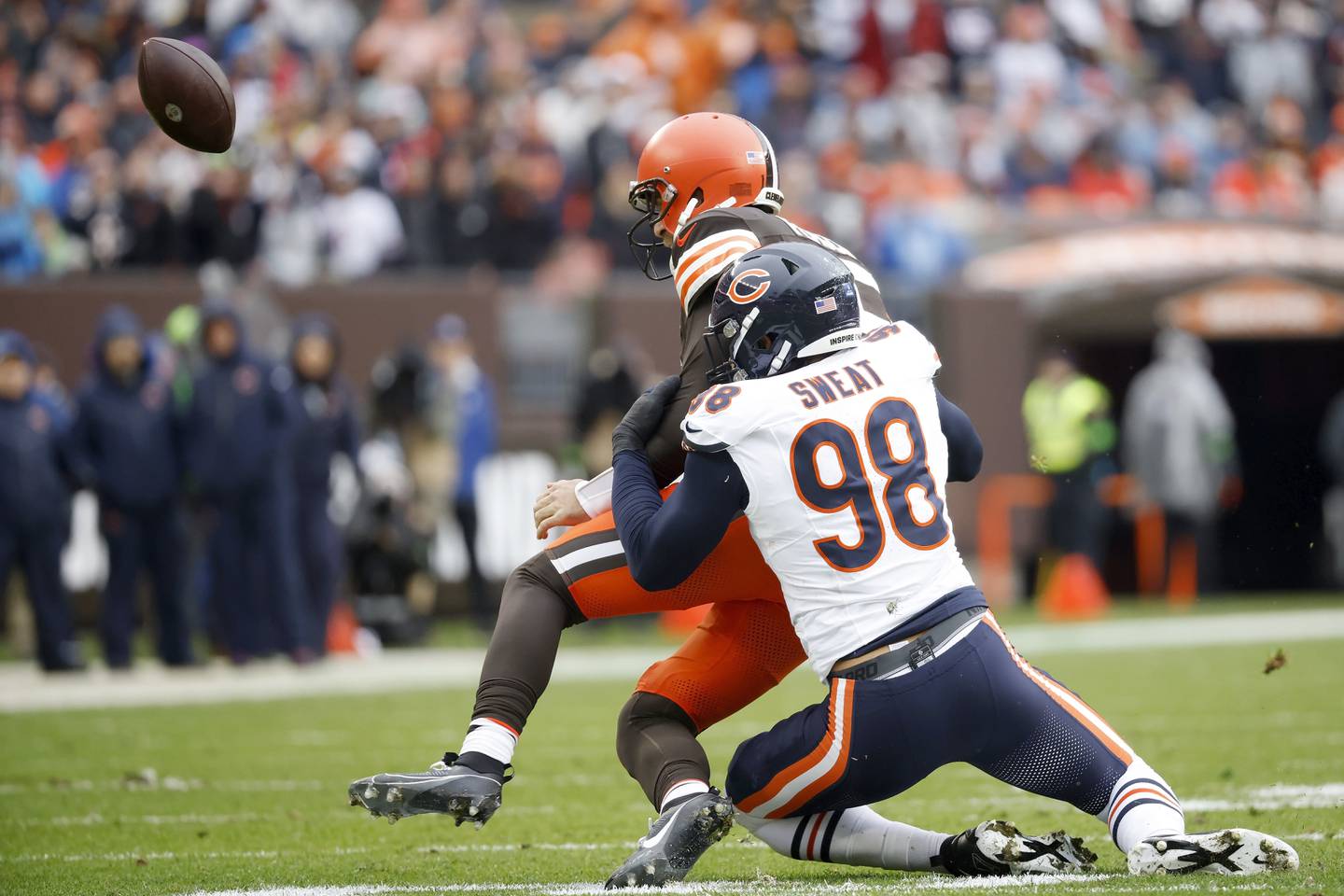 Chicago Bears defensive lineman Montez Sweat knocks the ball out of the hands of Cleveland Browns quarterback Joe Flacco, Sunday, Dec. 17, 2023, in Cleveland.