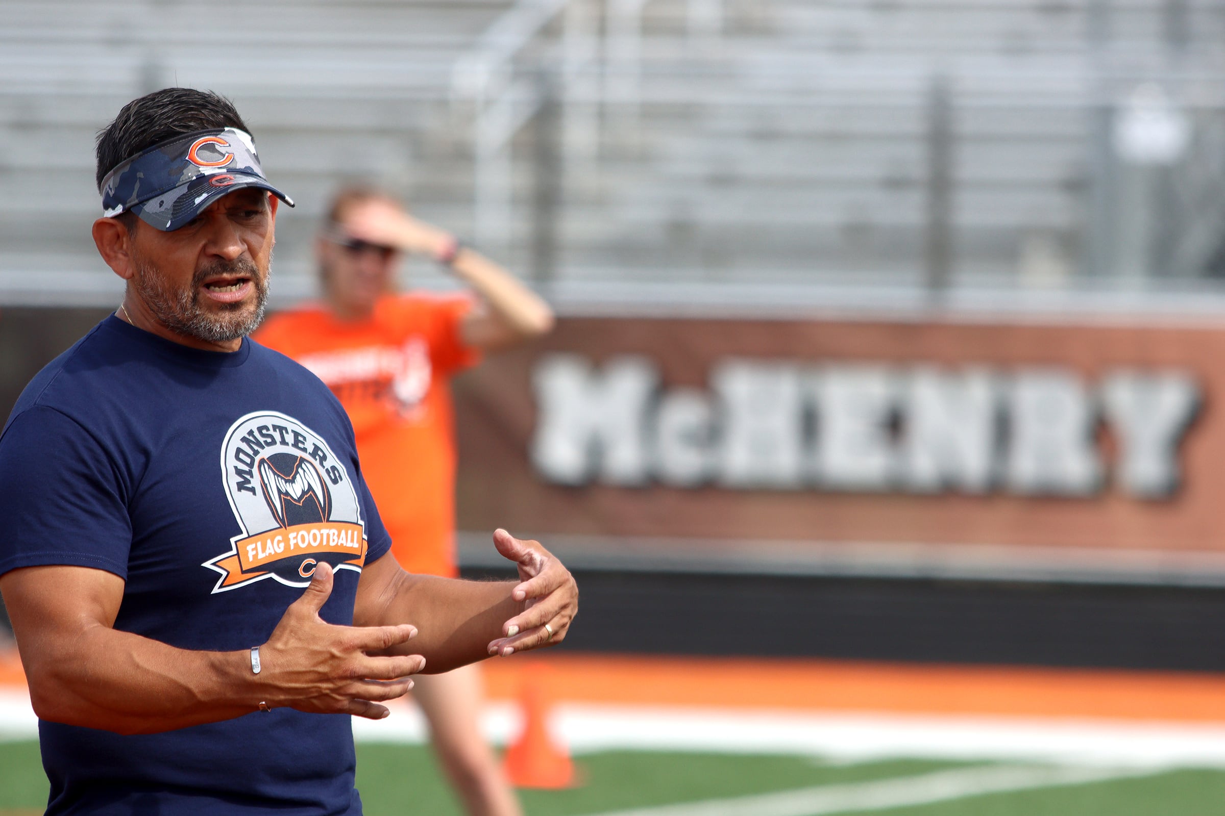 Gustavo Silva, Manager of Youth & High School Football for the Chicago Bears, greets athletes as the Chicago Bears and McHenry Community High School hosted a flag football clinic at McCracken Field Wednesday.