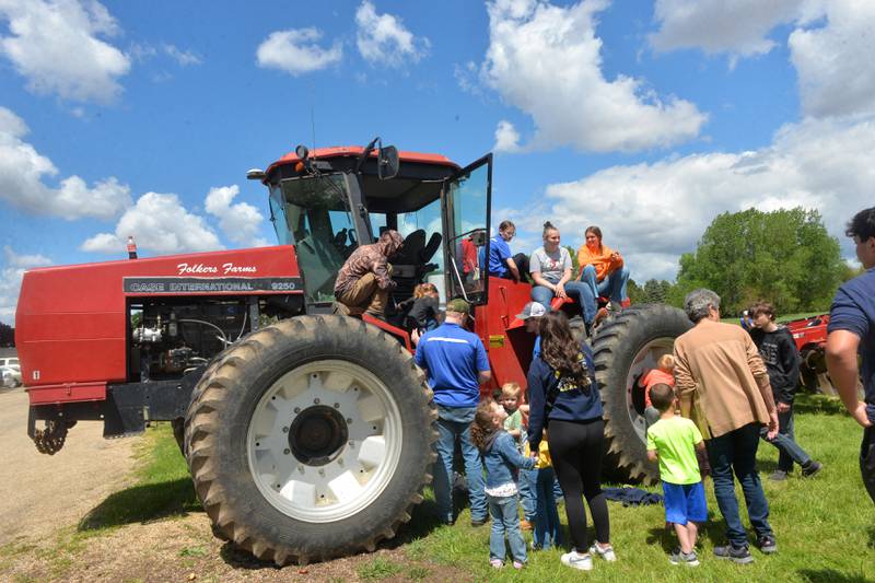 Centennial Grade School pre-kindergarteners investigate one of the tractors at the Polo High School's FFA Petting Zoo on Friday, May 10, 2024.