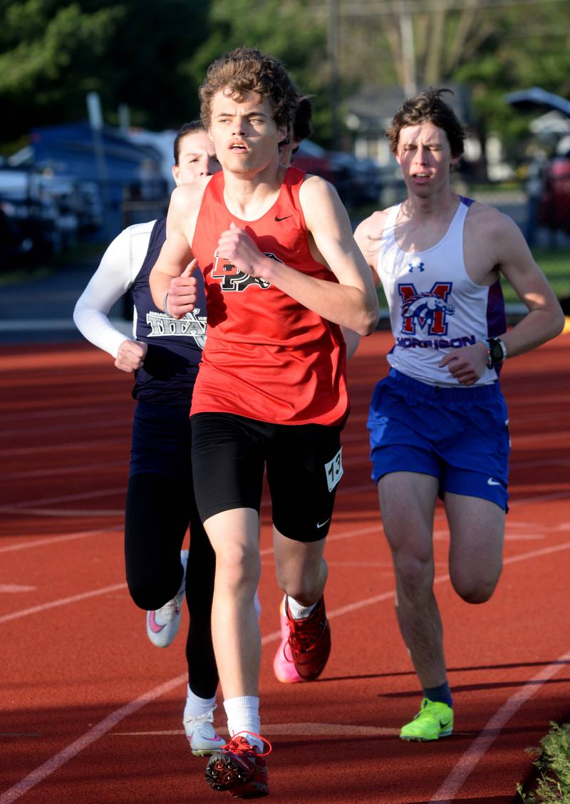 Erie-Prophetstown's Alex Bromlney (center) and Morrison's Isaiah McDermond (right) run the 3200 meters at the Ed Schmidt Invitational Track Meet at Erie High School on Friday, April 19, 2024.