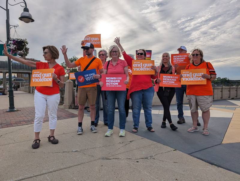 St. Charles community members gathered around St. Charles City Hall Friday, June 7, in orange t-shirts with signs promoting gun safety for the 10th National Gun Violence Awareness Day.