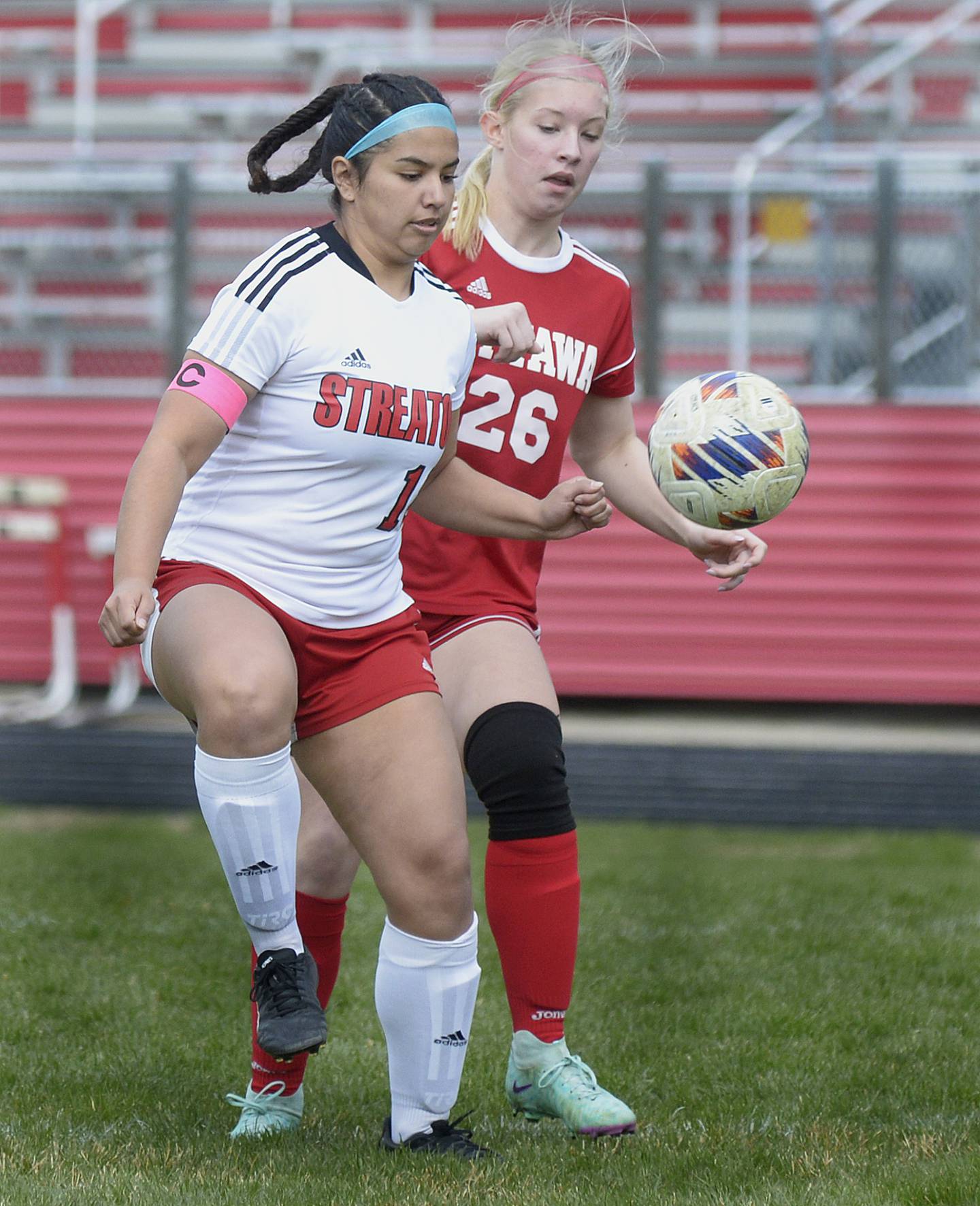 Streator’s ZuZu Gonzalez and Ottawa’s Taylor Brandt kick for possession during the match Saturday at Ottawa.