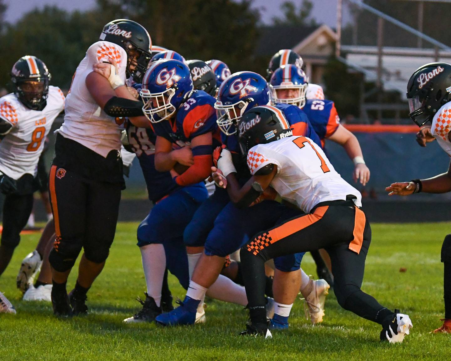 Genoa-Kingston's Owen Zaccard (33) runs the ball in for a touchdown during the game on Friday Aug. 30, 2024 while being held back by Leo High School defender played at Genoa-Kingston High School.