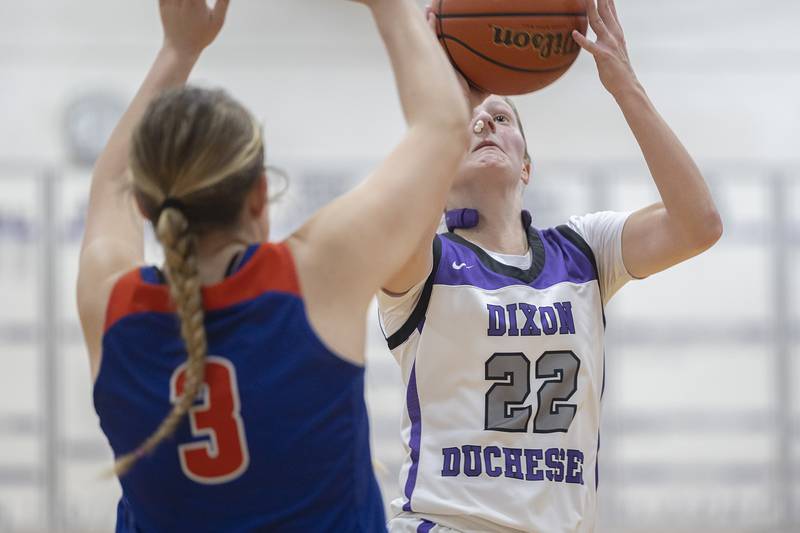 Dixon’s Katie Drew puts up a shot against Eastland’s Keni Burkholder Wednesday, Jan. 24, 2024 at Dixon High School.