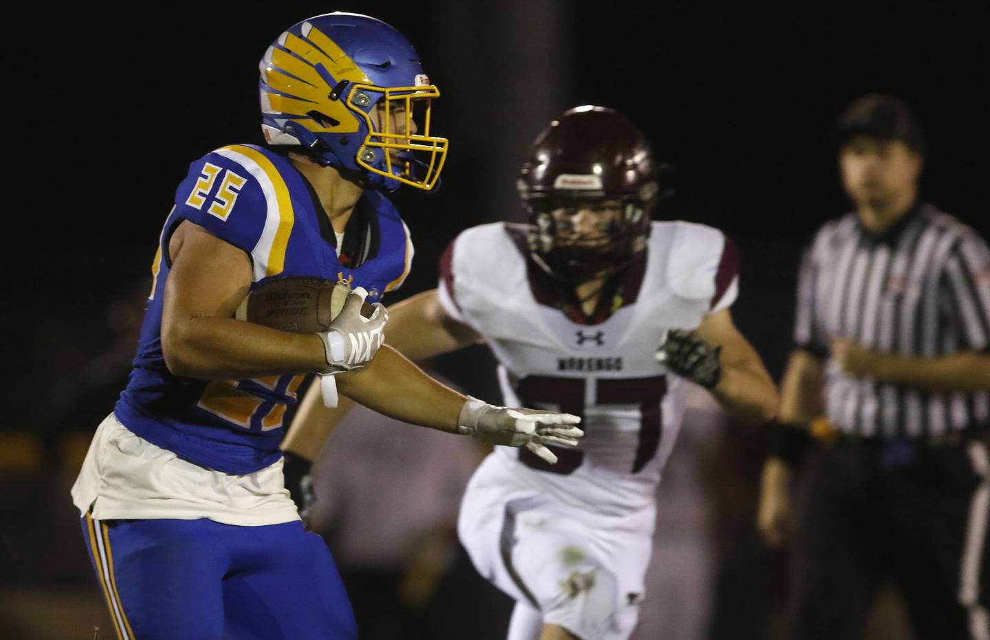 Johnsburg's Brett Centnarowicz runs with the ball as he is chased by Marengo’s Connor Sacco during a Kishwaukee River Conference football game on Friday, Sept. 15, 2023, at Johnsburg High School.