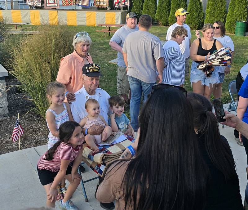 Leonard Wayne Lance is surrounded by family for a photo Saturday, Sept. 14, 2024, after he received a Quilt of Valor at Senica Square in Oglesby.