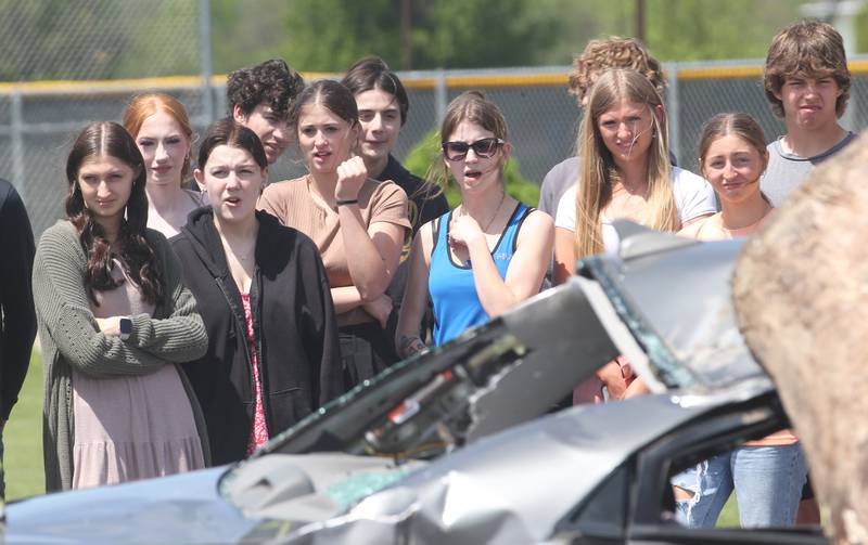 Putnam County High School students react as the watch fire and ems personnel work a fake "mock prom" scene on Friday, May 3, 2024 at Putnam County High School.  Putnam County Fire and EMS units, PC Sheriff, and OSF Lifeflight crew conducted a drill crash scene. The school's prom is Saturday. The program helps students make good choices on prom night.