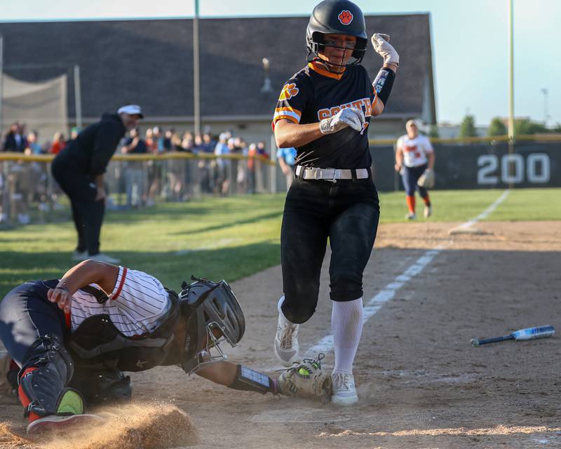 Wheaton-Warrenville South's Alli Michalowski (7) is tagged out at the plate by Oswego's Kiyah Chavez (10) during Class 4A Plainfield North Sectional semifinal softball game between Wheaton-Warrenville South at Oswego. May 29th, 2024.