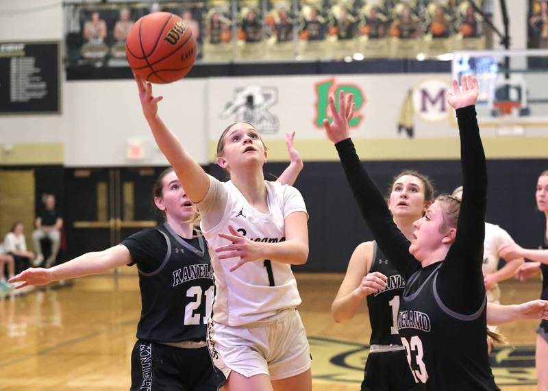 Sycamore's Quinn Carrier gets to the basket in front of Kaneland's Kyra Lilly during their Class 3A sectional semifinal Tuesday, Feb. 20, 2024, at Sycamore High School.
