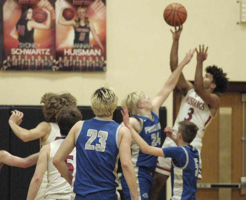 Morrison's DaeshaunMcQueen Puts a shoot up over Princeton's Daniel Sousa during the Morrison vs Princeton class 2A basketball regional final at Prophetstown High School on Friday, Feb. 23 .