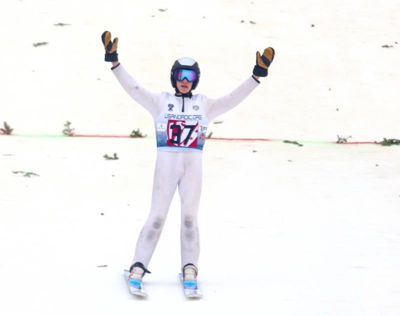 Henry Loher of Team NYSEF celebrates upon landing during the 119th Norge Annual Winter Ski Jump Tournament in Fox River Grove Sunday.