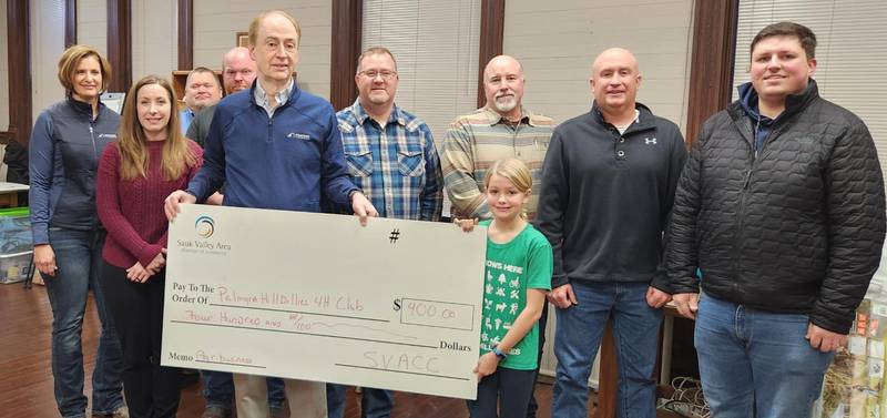 The Palmyra Hillbillies 4H Club receives a donation from the Sauk Valley Area Chamber of Commerce.