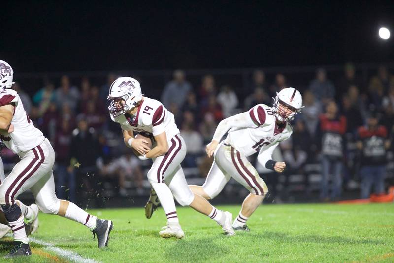 Crystal Lake Central's Carter Kelley looks to advance the ball against Prairie Ridge's defense on Friday, Oct.18, 2024 in Crystal Lake.