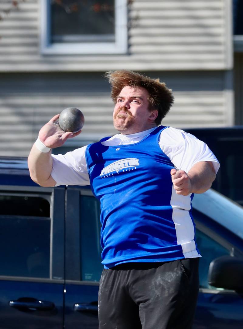 Princeton's Payne Miller puts his might into the shot put in Tuesday's Howard-Monier Invite.