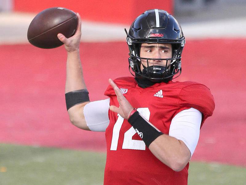 Northern Illinois University senior quarterback Ross Bowers fires a pass Friday during football practice at Huskie Stadium.