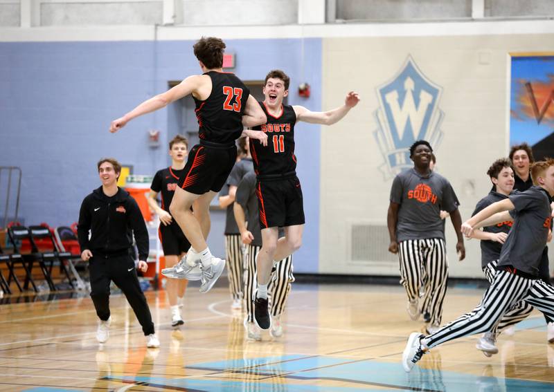 Wheaton Warrenville South players Max O’Connell (left) and Matt Nadelhoffer celebrate their win over Geneva in a Class 4A Willowbrook Regional semifinal game on Wednesday, Feb. 21, 2024.