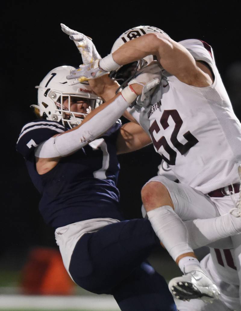 Joe Lewnard/jlewnard@dailyherald.com
St. Viator’s Michael Tauscher, left, gets hit by Wheaton Academy’s Greyson Kelly on a play that went for a 15-yard pass interference penalty during Friday’s Class 4A football playoff game in Arlington Heights Friday.