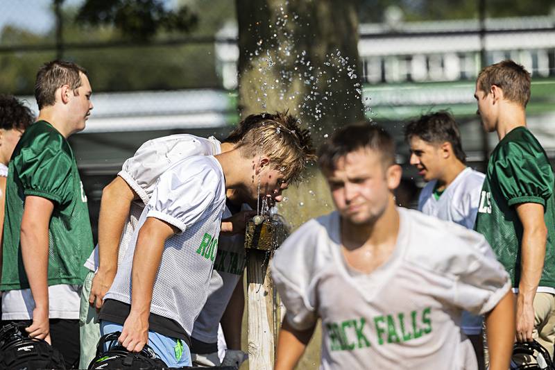 Rock Falls Rockets grab a drink Tuesday, Aug. 13, 2024 during the first week of practice.