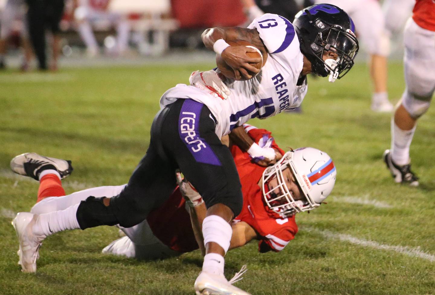 Plano's Amari Bryant stays on his feet as Ottawa's George Schumway misses the tackle in August 2024 at King Field.