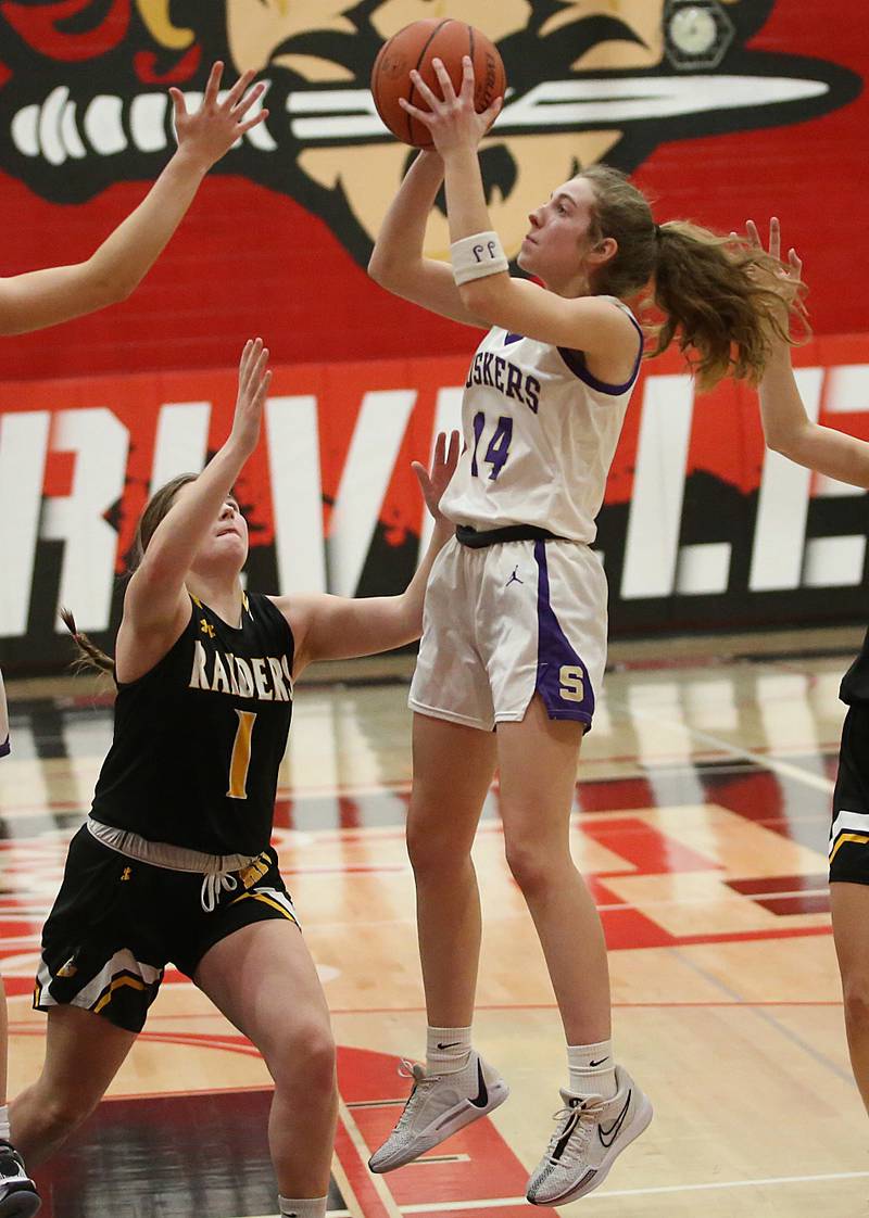 Serena's Macy Mahler eyes the hoop as Ashton-Franklin Center's Alexis Schwarz defends during the Class 1A Regional final on Thursday, Feb. 15, 2024 at Earlville High School.