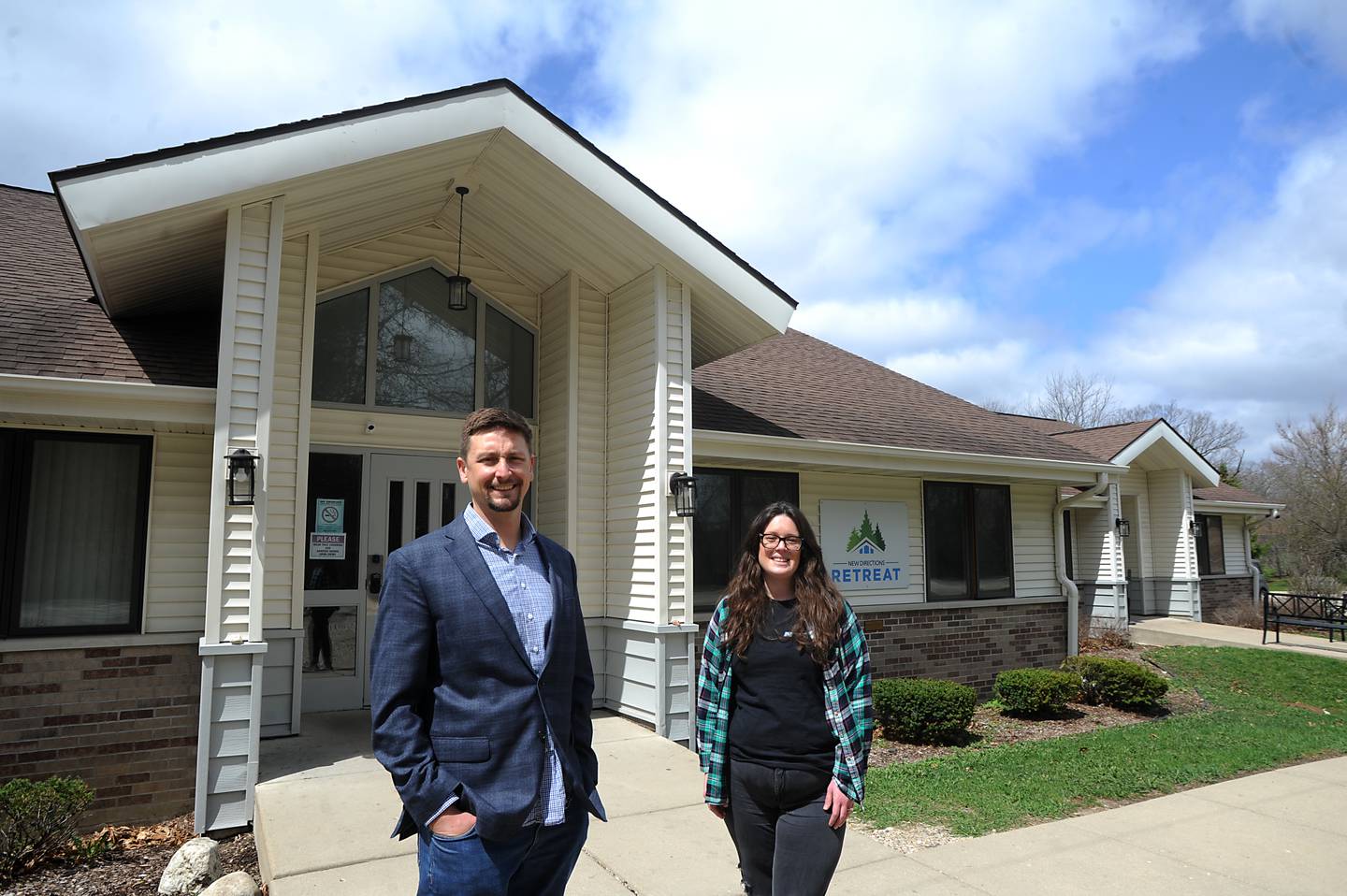 New Directions Addiction Recovery Executive Executive Director Bobby Gattone and office manager Jessica Darnell outside the New Direction facility at 14411 Kishwaukee Valley Road in Woodstock. The nonprofit received almost $1 million in a grant from the county to open a new facility to further its addiction recovery efforts.