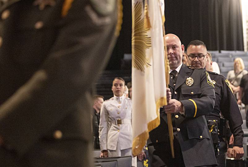 The first class of SVCC Police Academy Basic Law Enforcement is lead into Centennial Auditorium in Sterling Friday, April 14, 2023 for the school’s first graduation ceremony.