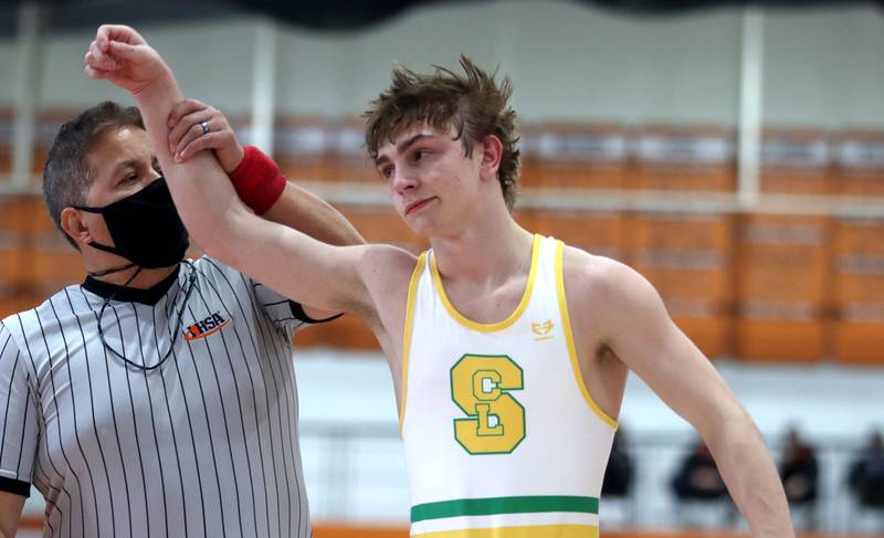 Crystal Lake South’s Josh Glover won the title bout at 113 pounds over Wauconda’s Gavin Rockey during IHSA Class 2A regional wrestling at Crystal Lake Central Saturday.