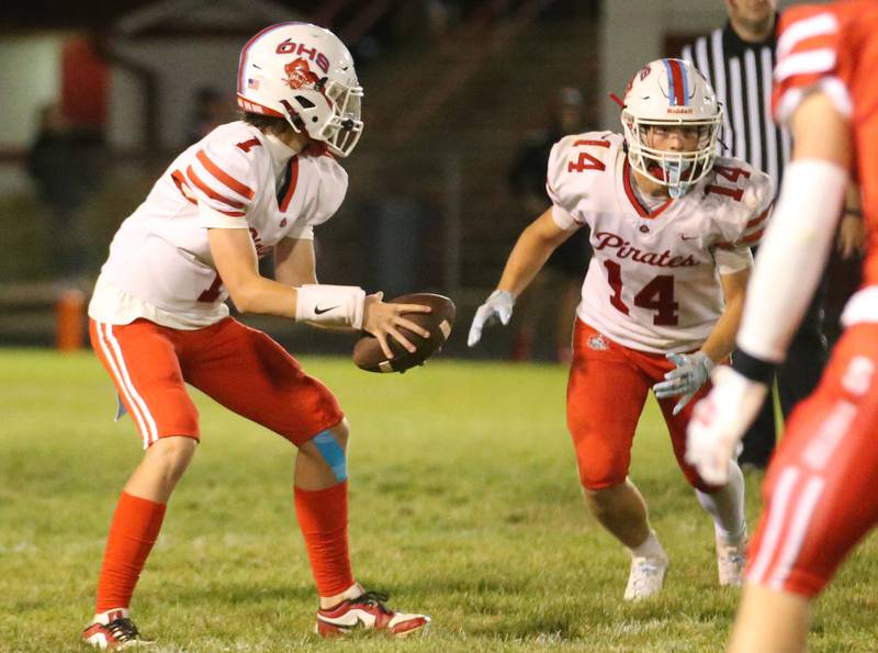 Ottawa quarterback Munson hands the ball off to teammate Archer Cechowicz on Friday, Sept. 6, 2024 at Doug Dieken Stadium.